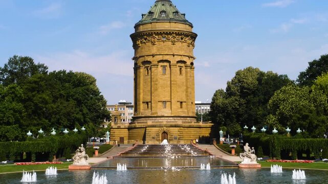  A street view in the downtown of the city Mannheim around the water tower in Germany on a sunny noon in summer.