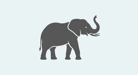 Fototapeta premium Gray elephant standing alone profile view.