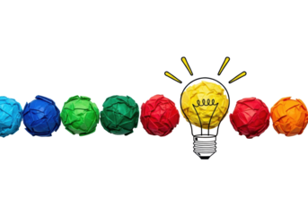Meticulously arranged vibrant crumpled paper balls leading to a yellow lightbulb paper ball with hand-drawn rays on a transparent background, top-down view. Concept of innovation and ideation