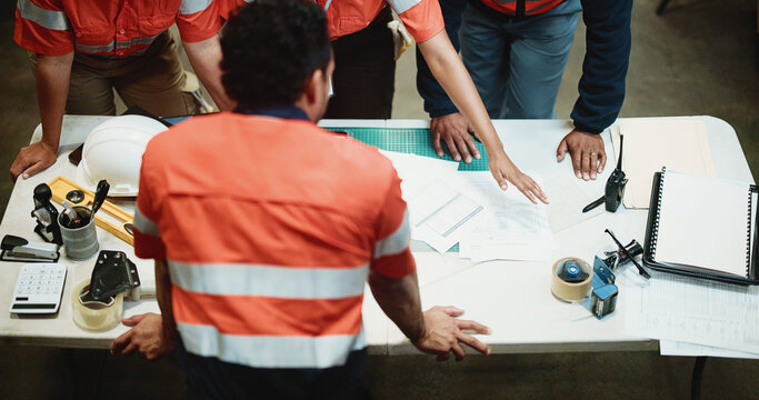 Above, logistics or team in warehouse with paper, discussion or order backlog in supply chain. Distribution, people or workers with documents, inventory management or collaboration in stock control. - Powered by Adobe