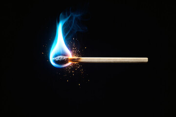 A burning matchstick with a vibrant blue flame against a dark background, the match is about to burn out