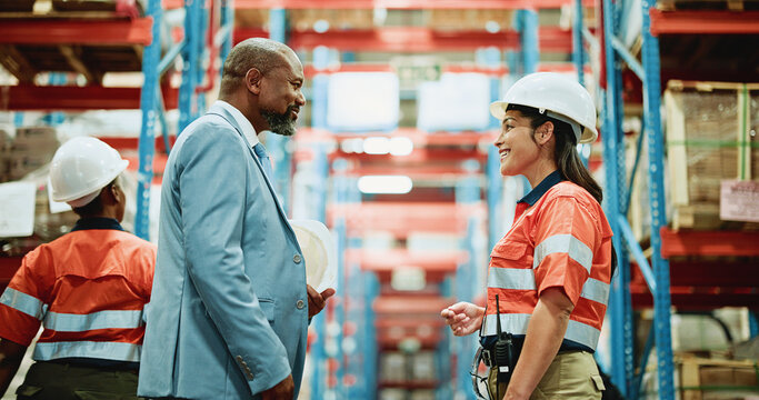 People, contractor and warehouse with manager for inventory check, supply chain or logistics. Man, woman or mentor with employees for shipping, distribution or quality assurance in storage depot