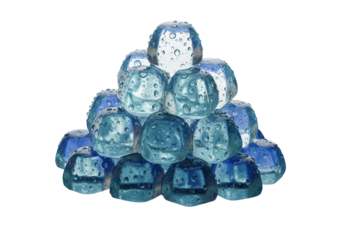 Small, clear aquamarine ice cubes with water droplets piled on a wet, reflective sapphire-blue surface against a white studio background, diffused lighting. Concept of refreshing coolness and