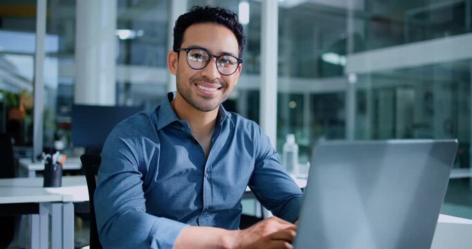 Face, businessman and laptop in office for finance report, company audit or online research. Accountant, portrait and glasses with tech for performance review, management or bookkeeping at firm