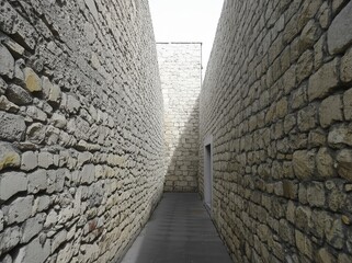 High walls enclosing the street