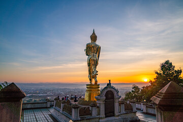 4. The golden Buddha statue at Wat Khao Noi welcomes the sunrise, symbolizing faith, tranquility, and the cultural heritage of Nan.