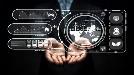 Hands Displaying Digital Interface with Wind Energy Icons and Data Visualizations Illustrating Sustainable Energy Options and Modern Technology Concepts