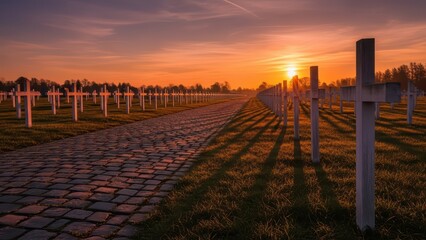 Obraz premium Sunset over peaceful military cemetery with endless white crosses and cobblestone path in tranquil serenity