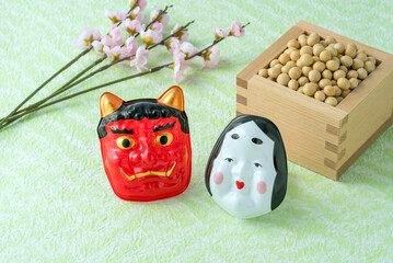 節分の鬼とおかめのお面と福豆