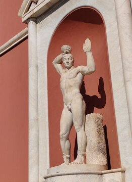 Rome, Italy - October 15, 2025, a statue depicting an Olympic athlete in a niche of the CONI (Italian National Olympic Committee) building.