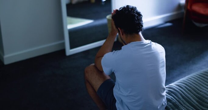 Mental health, stress or man in bedroom with guilt, anxiety trigger or memory of past mistake. Grief, flashback or above of male person in house with sadness, loss or frustrated in emotional thoughts