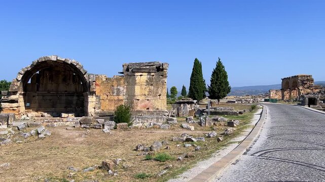 HIERAPOLIS in Denizli, TURKEY, August 13, 2024: The ancient city of Hierapolis near Pamukkale, against the backdrop of nature and mountains. The Phrygian period.UNESCO.4K