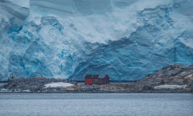 Port Lockroy Antarctica Penguin Post Office Close Up Wall of Ice Penguins. Remote British Science Station. Penguin Colony Habitat Frozen Landscape © And They Travel