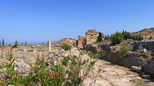 HIERAPOLIS in Denizli, TURKEY, August 13, 2024: The ancient city of Hierapolis near Pamukkale, against the backdrop of nature and mountains. The Phrygian period.UNESCO.4K