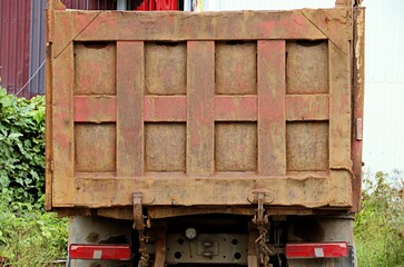 Rear view of a truck with high metal sides