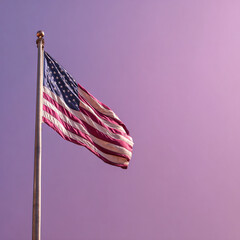 The American flag waving on a flagpole against a purple sky background