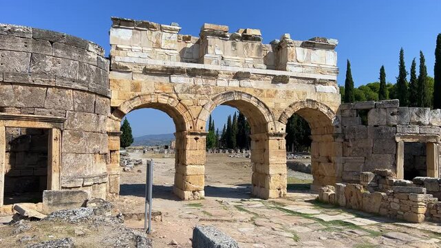 HIERAPOLIS in Denizli, TURKEY, August 13, 2024: The ancient city of Hierapolis near Pamukkale, against the backdrop of nature and mountains. The Phrygian period.UNESCO.4K