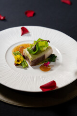 A top-down view of an elegantly plated dish with gourmet cuisine, a culinary masterpiece