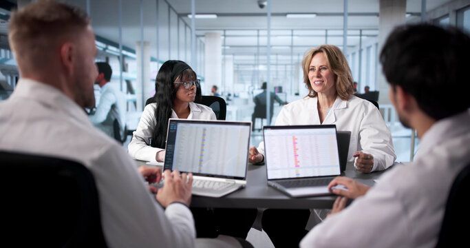 Hospital Team Using Computerized Coding - Powered by Adobe