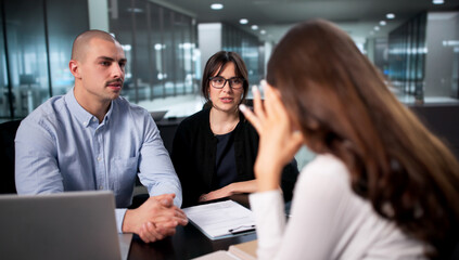 Fototapeta premium Unhappy Manager Conducts Disciplinary Meeting With Stressed Employee
