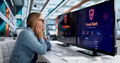Fraud Investigator Analyzing Security Alert Screen On Computer