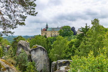 Naklejka premium Hruba Skala Castle among sandstone rocks and green forest, Czechia