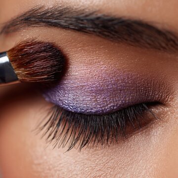 Beauty close-up with brush and makeup