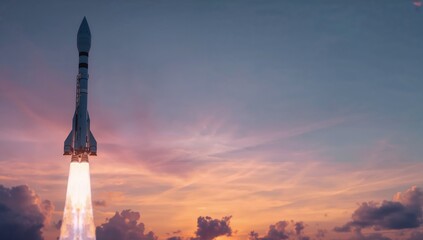 Rocket Launch Against Colorful Sunrise Sky with Cloudy Horizon