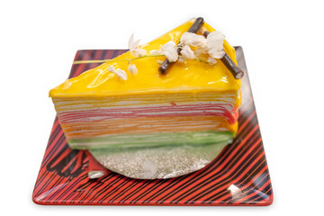 Die cut of rainbow crepe cake on white isolated.