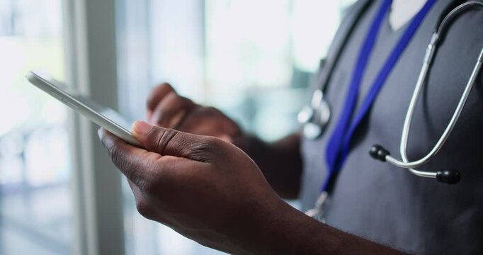 Hands, nurse and scroll with tablet in hospital for patient information, appointment and schedule. Clinic, database and healthcare person with technology for telehealth, medical service or research