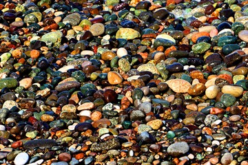 Background, texture of pebble sea beach, sea surf line