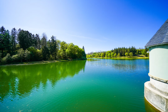 View of the Panzer Dam and the surrounding landscape near Remscheid. Nature by the lake in North Rhine-Westphalia.
