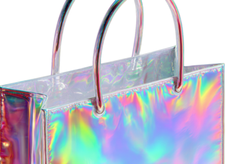 A shimmering, iridescent tote bag with reflective handles stands against a transparent background