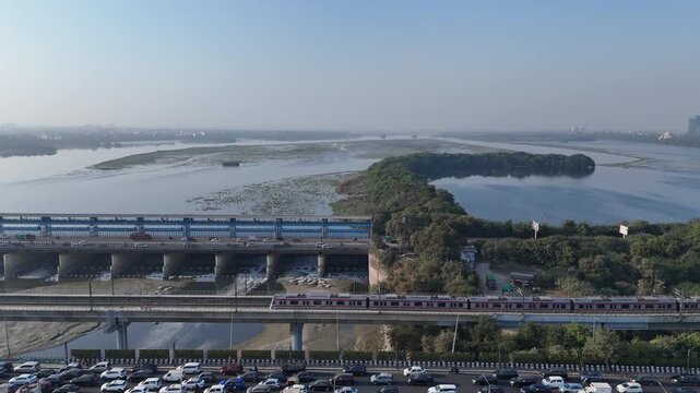 An Aerial Shot of Delhi Metro at Kalindi Kunj Bridge in Delhi, NCR, India