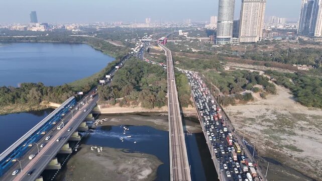 An Aerial Shot of Delhi Metro at Kalindi Kunj Bridge in Delhi, NCR, India