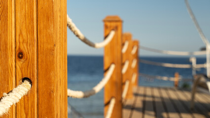 rope fence on the pier by the sea