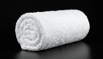 Rolled White Towel on Dark Surface with Visible Spiral