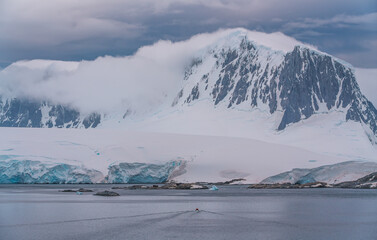 Port Lockroy Antarctica Red Hut Shuttle Boat Moves Towards it Wide. Penguin Post Office British Science Station Penguin Colony Natural Habitat