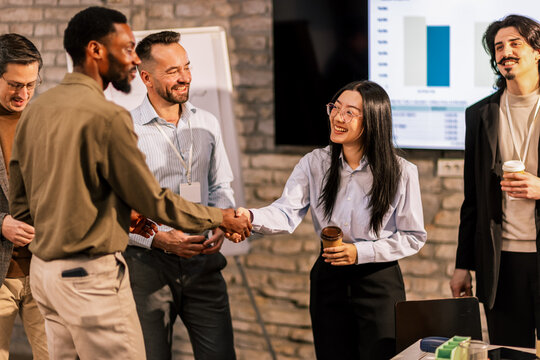 New Multiracial Colleagues Meeting on Coffee Break - Powered by Adobe