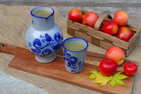 Naturally cloudy apple wine in a traditional stoneware jug, a specialty from Hesse, Germany.