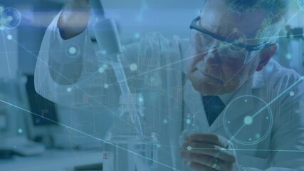 Animation of network of connections over caucasian senior male scientist working at laboratory - Powered by Adobe