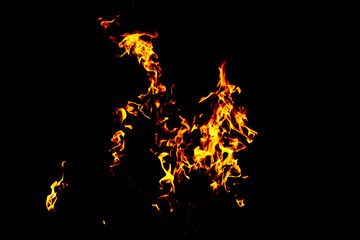 Fire flame texture. Burning material backdrop. Burn effect pattern. Blaze and torch wallpaper. Heat and haze backdrop.
