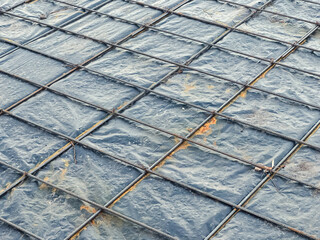 Close-up of steel rebar grid for construction reinforcement.
