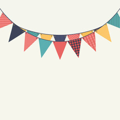 Obraz premium Colorful party bunting flags hanging against a simple neutral background