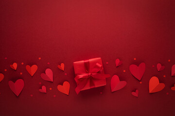 Saint Valentine day background with red hearts and gift box. Festive card for dating and romantic...