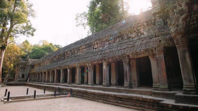 Ancient stone ruins of ta prohm temple in cambodia. Beautiful warm sunlight shining on the historic khmer architecture. Cambodia, Siem Reap. Archeology concept.