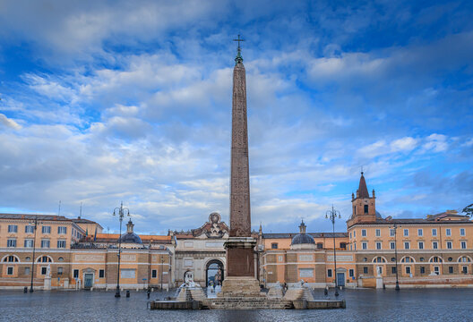 Glimpse of Valadier's Piazza del Popolo (People Square) in Rome, Italy: in the centre the Fontana dell'Obelisco (Obelisk Foutain) and in background the city gate of Porta del Popolo (People's Gate).