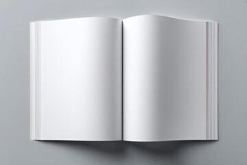 Naklejka premium An open blank book/magazine with white pages on a neutral grey background, top-down view