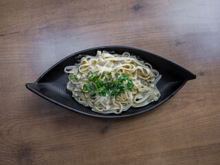 delicious traditional pasta on wooden restaurant table