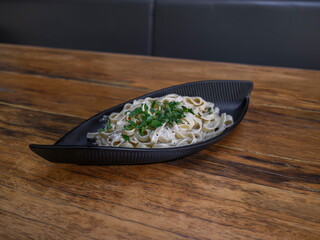 delicious traditional pasta on wooden restaurant table